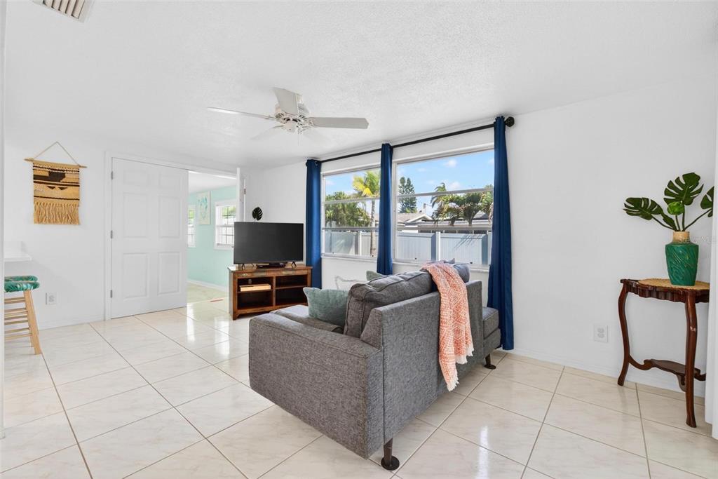11225 59th Avenue Seminole, FL 33772 - Photo 3 of 15 a living room with furniture and a flat screen tv