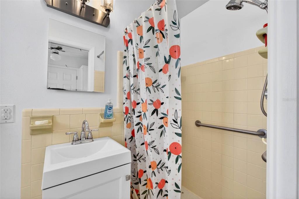 11225 59th Avenue Seminole, FL 33772 - Photo 5 of 15 a bathroom with a sink and mirror with toilet