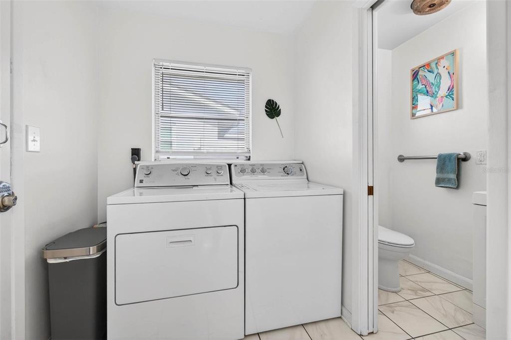 11225 59th Avenue Seminole, FL 33772 - Photo 6 of 15 a utility room with dryer and washer