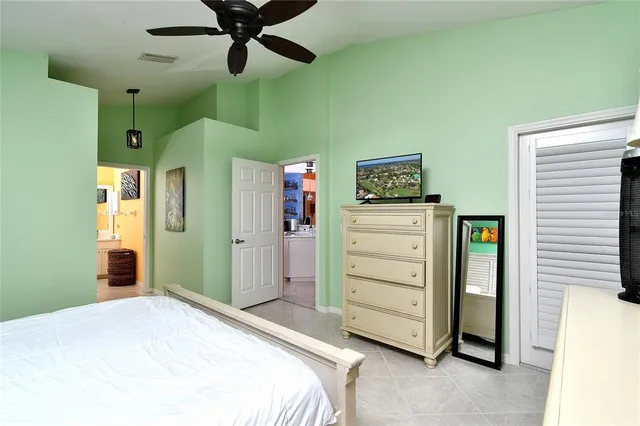 a bedroom with a bed and a cabinets