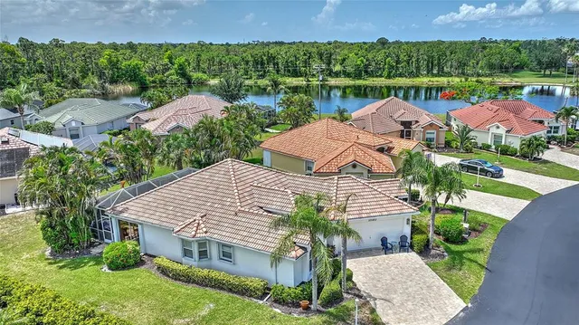 an aerial view of a house with garden space and a patio
