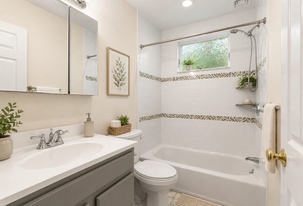 403-405 Reedsdale Road Milton, MA 02186 - Photo 12 of 21 a bathroom with a sink a toilet and a bathtub