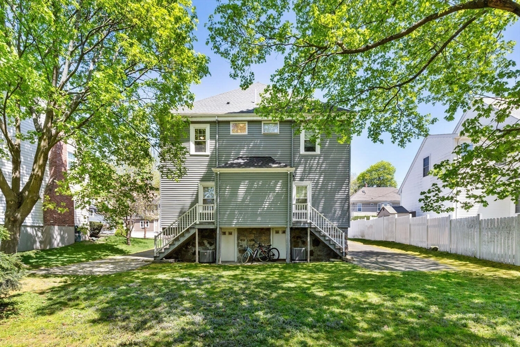 403-405 Reedsdale Road Milton, MA 02186 - Photo 16 of 21 front view of a house with a big yard