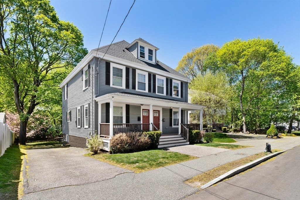 403-405 Reedsdale Road Milton, MA 02186 - Photo 2 of 21 a front view of a house with a garden