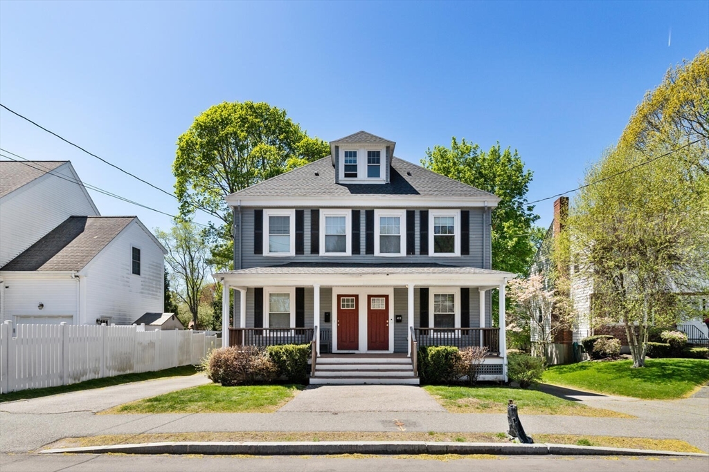 403-405 Reedsdale Road Milton, MA 02186 - Photo 3 of 21 a front view of a house with a garden