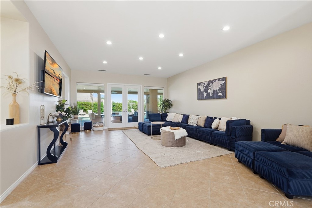9 Orleans Road Rancho Mirage, CA 92270 - Photo 15 of 71 a living room with furniture and a large window