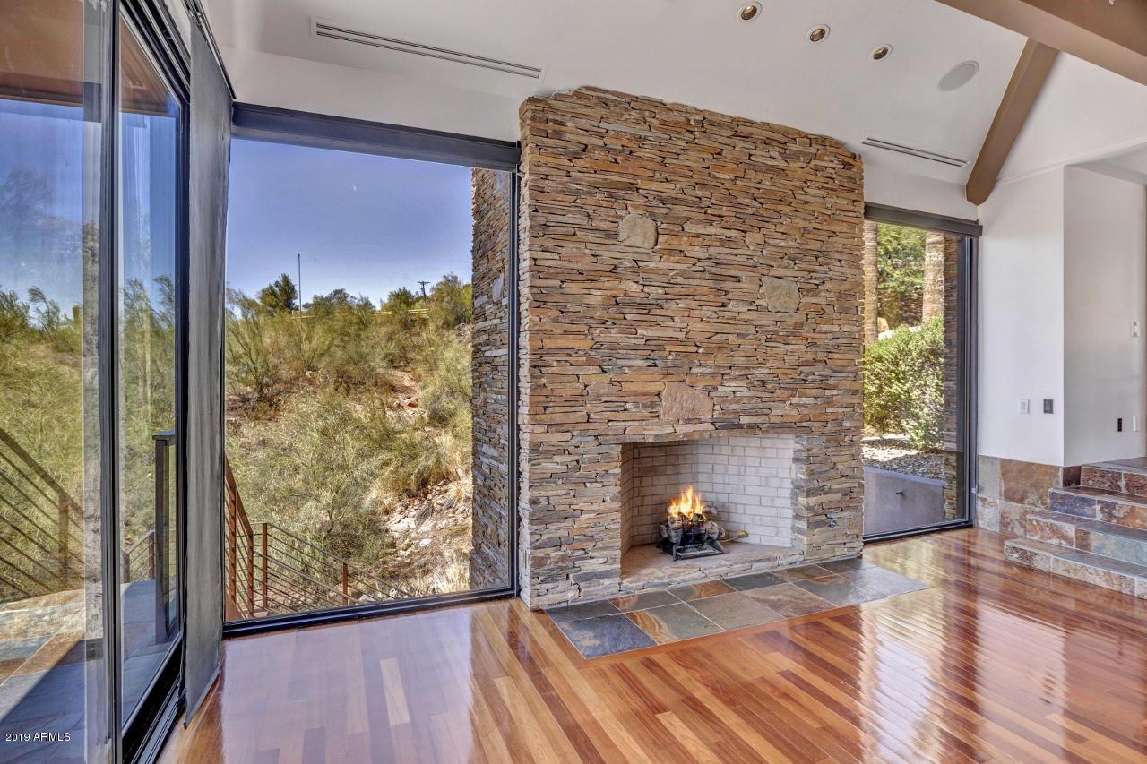 5401 East Wonderview Road Phoenix, AZ 85018 - Photo 13 of 58 Fireplace in dining room