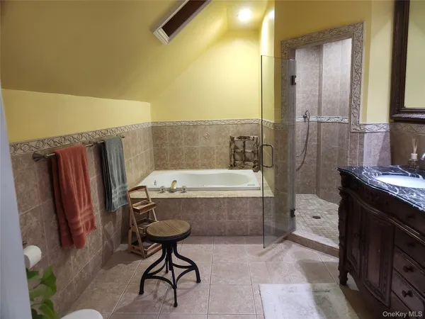 a bathroom with a bathtub and a sink
