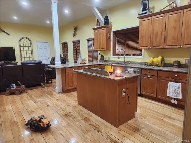 a kitchen with wooden cabinets and sink