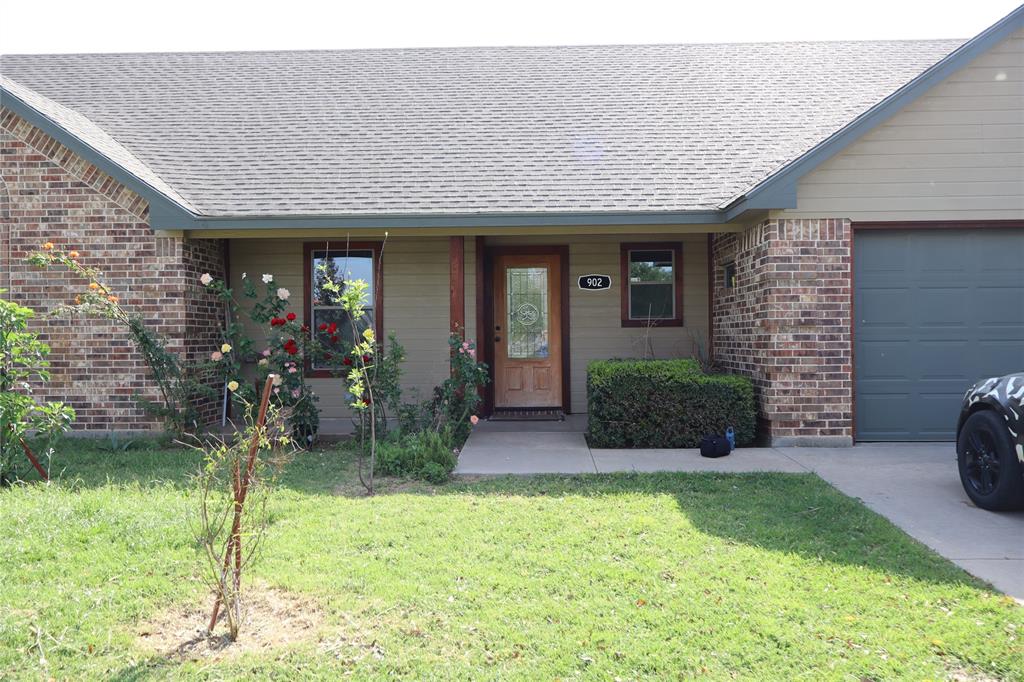 902 El Campo Drive Rio Vista, TX 76093 - Photo 2 of 11 a front view of a house with a yard