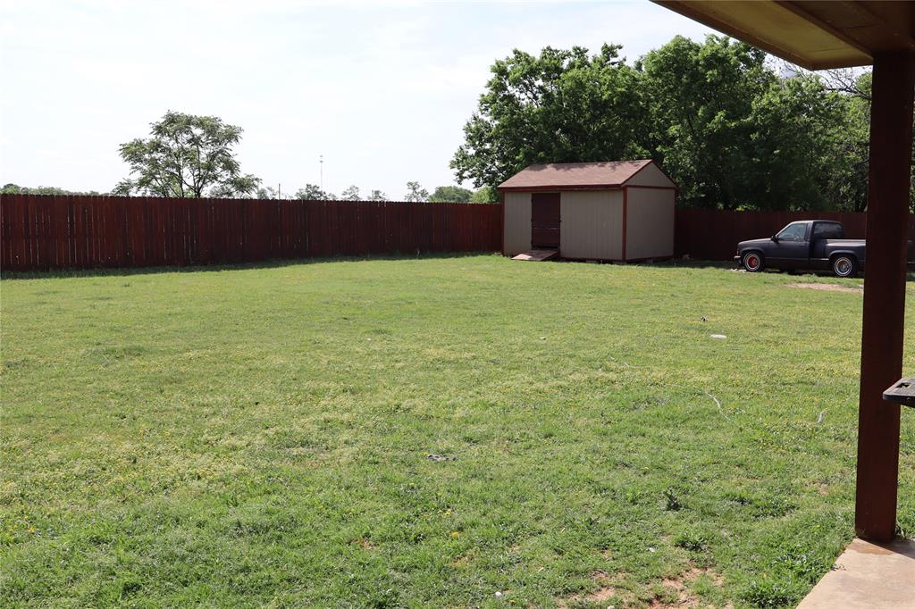 902 El Campo Drive Rio Vista, TX 76093 - Photo 8 of 11 a front view of a house with a yard