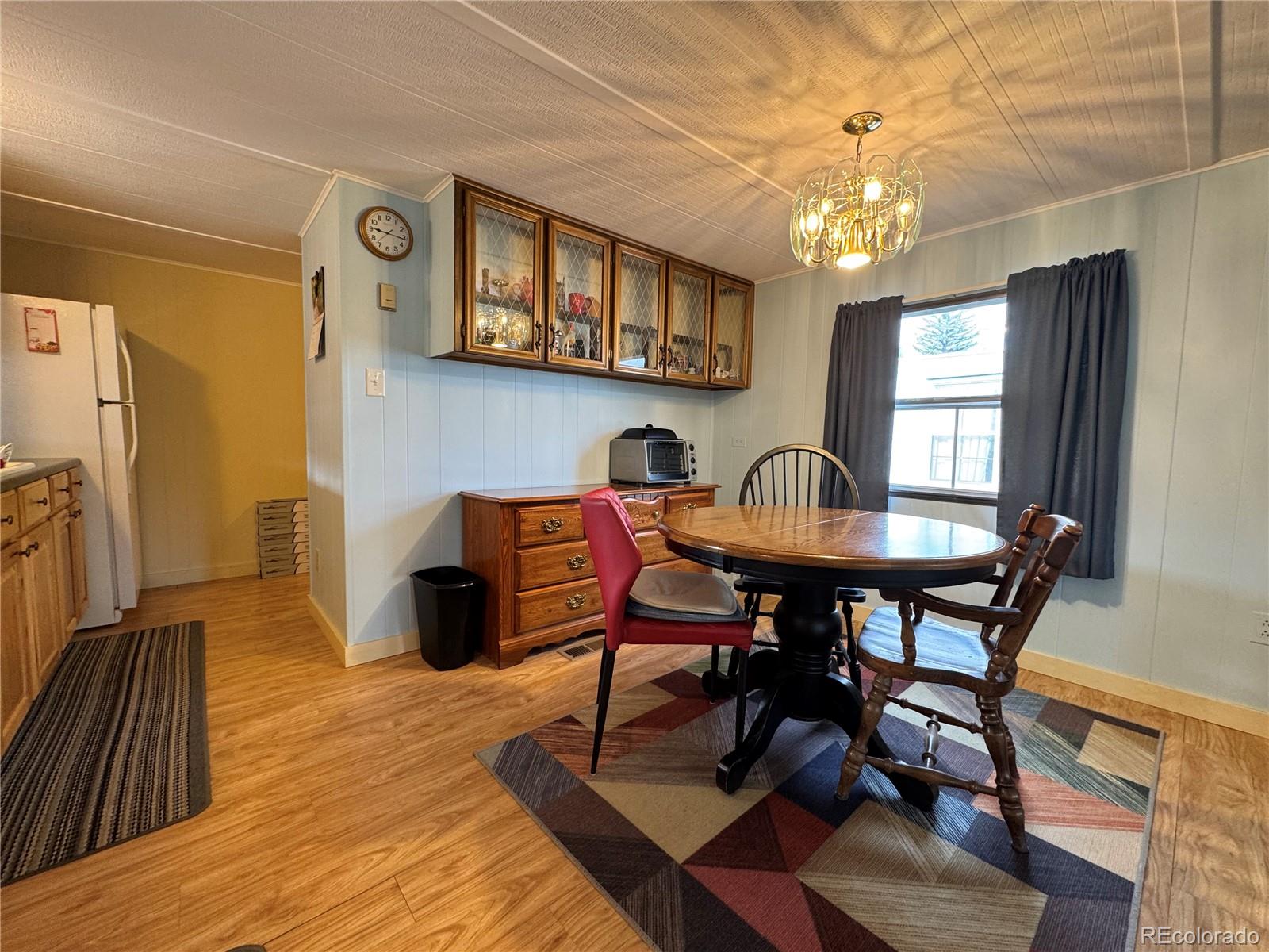 910 J Street, Unit F2 Salida, CO 81201 - Photo 6 of 18 a view of a dining room with furniture and chandelier