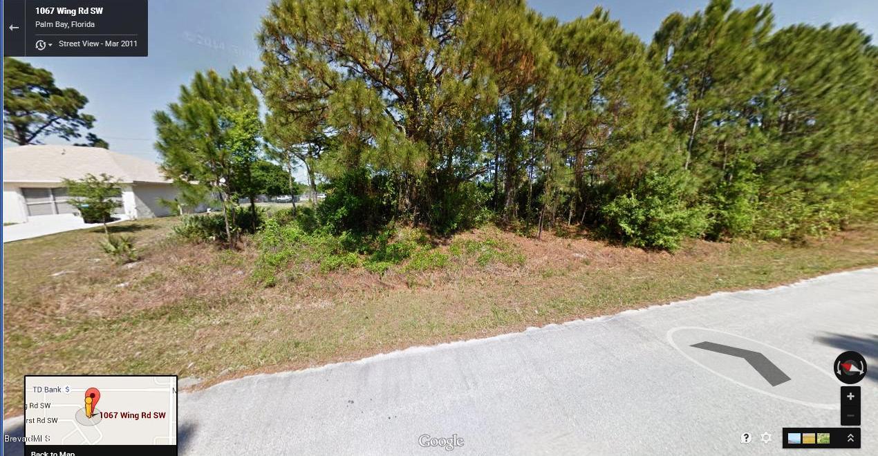 1067 Wing Road Southwest, Unit 20 Palm Bay, FL 32908 - Photo 1 of 7 a view of a yard with plants