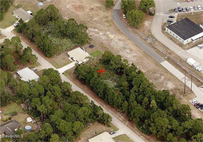 1067 Wing Road Southwest, Unit 20 Palm Bay, FL 32908 - Photo 2 of 7 an aerial view of a house with a yard