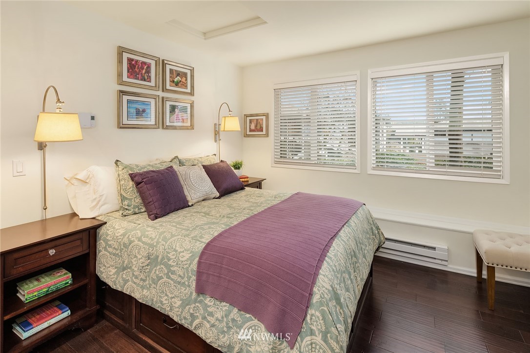 7581 Old Redmond Road, Unit 1 Redmond, WA 98052 - Photo 12 of 19 a bedroom with a bed and wooden floor