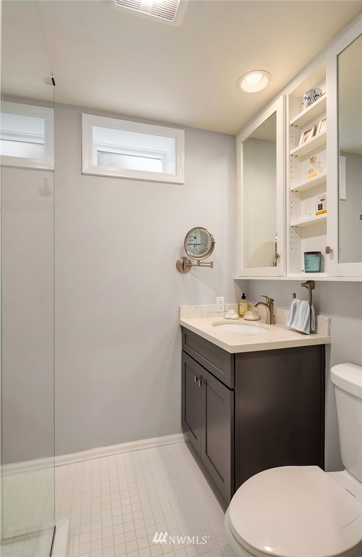 7581 Old Redmond Road, Unit 1 Redmond, WA 98052 - Photo 14 of 19 a bathroom with a sink vanity mirror and toilet
