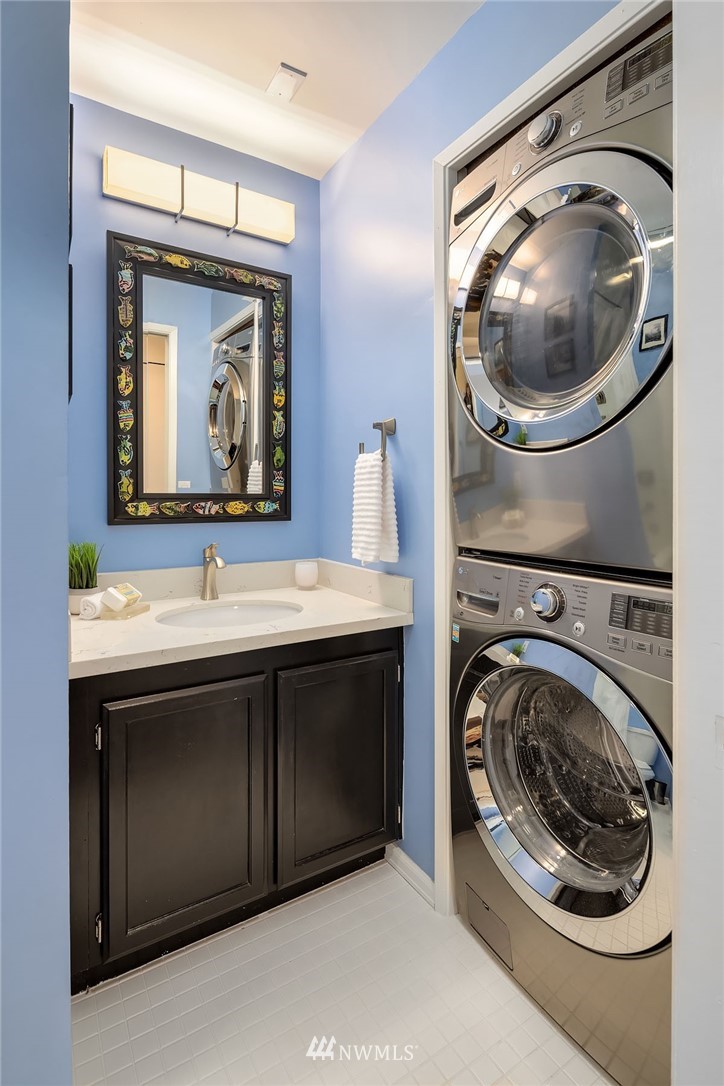 7581 Old Redmond Road, Unit 1 Redmond, WA 98052 - Photo 18 of 19 a utility room with a sink and a washer dryer