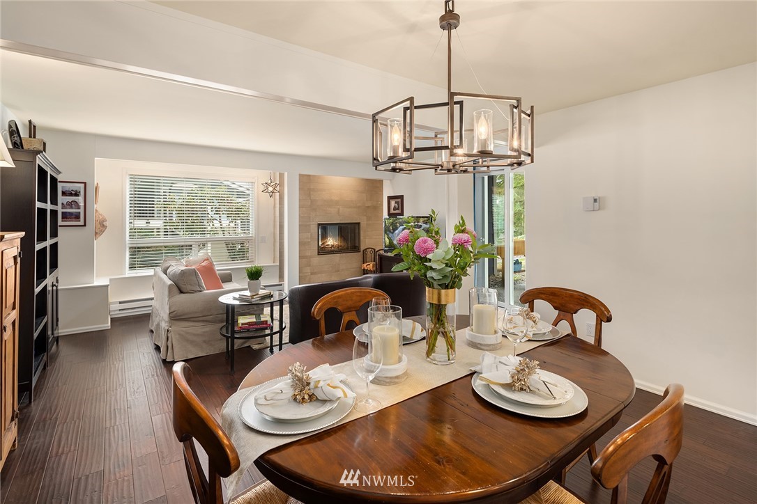 7581 Old Redmond Road, Unit 1 Redmond, WA 98052 - Photo 5 of 19 a dining room with furniture a chandelier and window