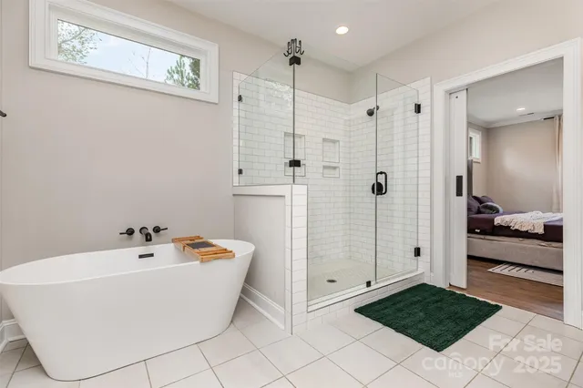 a bathroom with a bathtub and a shower