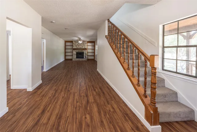 a view of staircase with wooden floor and staircase