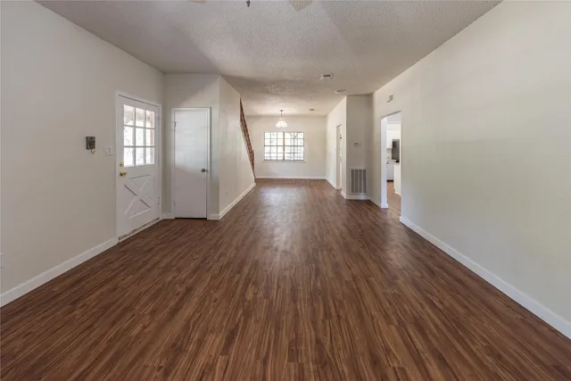 a view of gallery with wooden floor