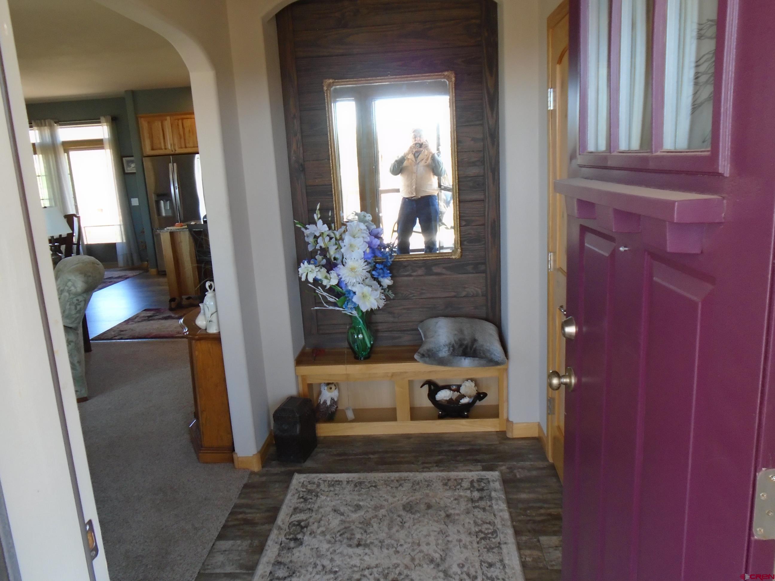 23041 T Road Cedaredge, CO 81413 - Photo 14 of 28 a living room with furniture and a potted plant
