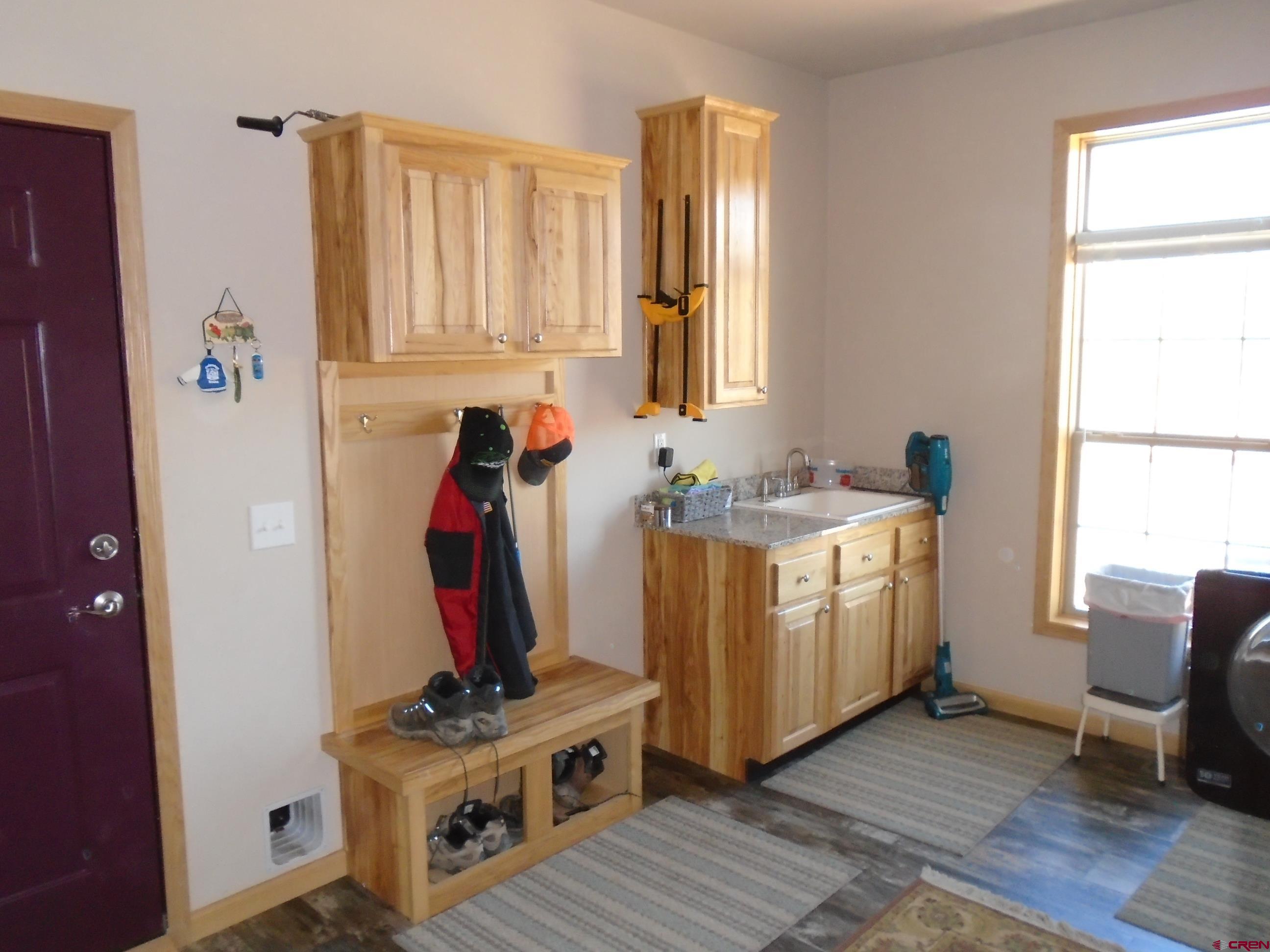 23041 T Road Cedaredge, CO 81413 - Photo 19 of 28 a view of kitchen with wooden floor