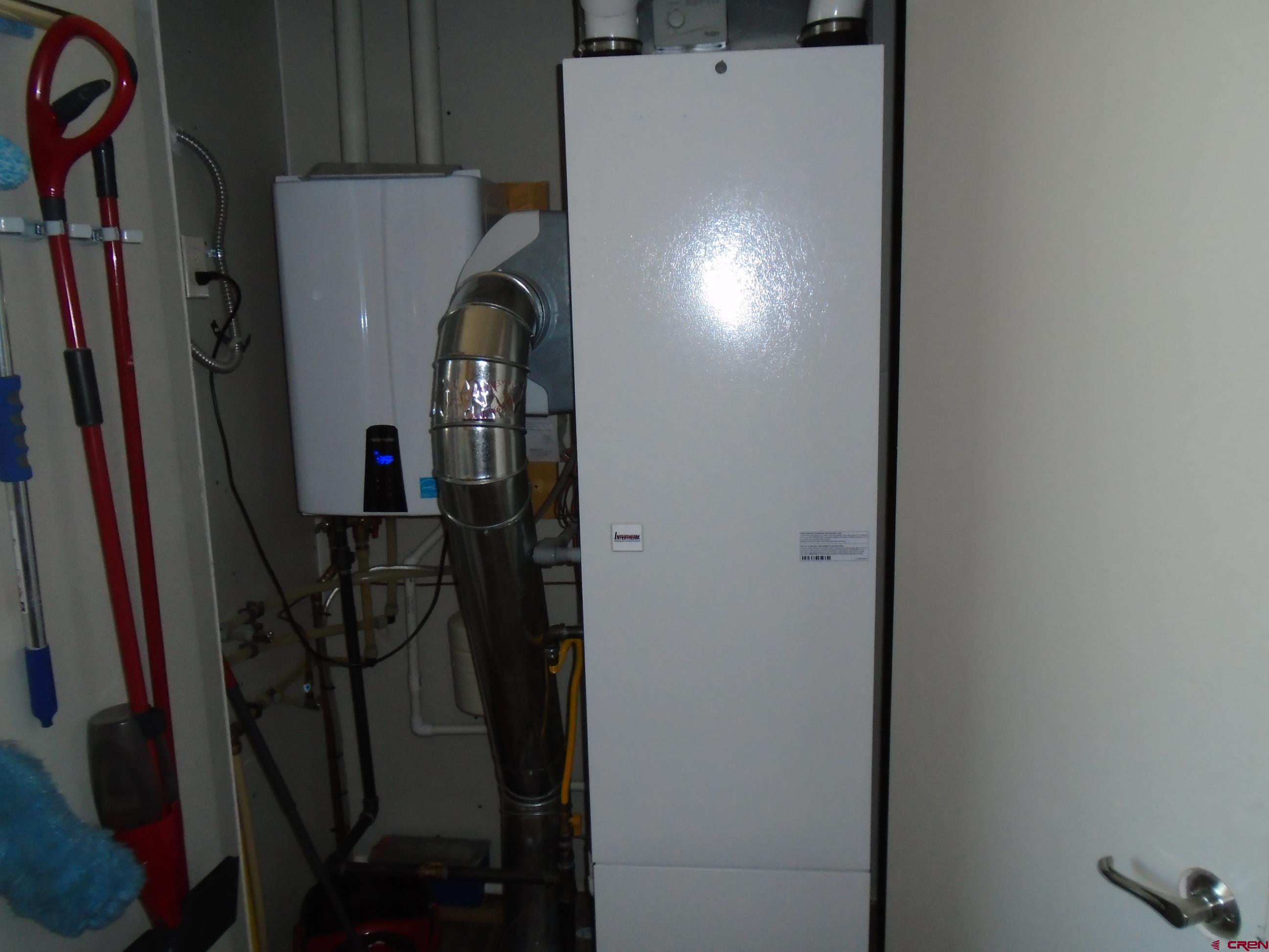 23041 T Road Cedaredge, CO 81413 - Photo 22 of 28 a view of a hallway with wooden cabinets
