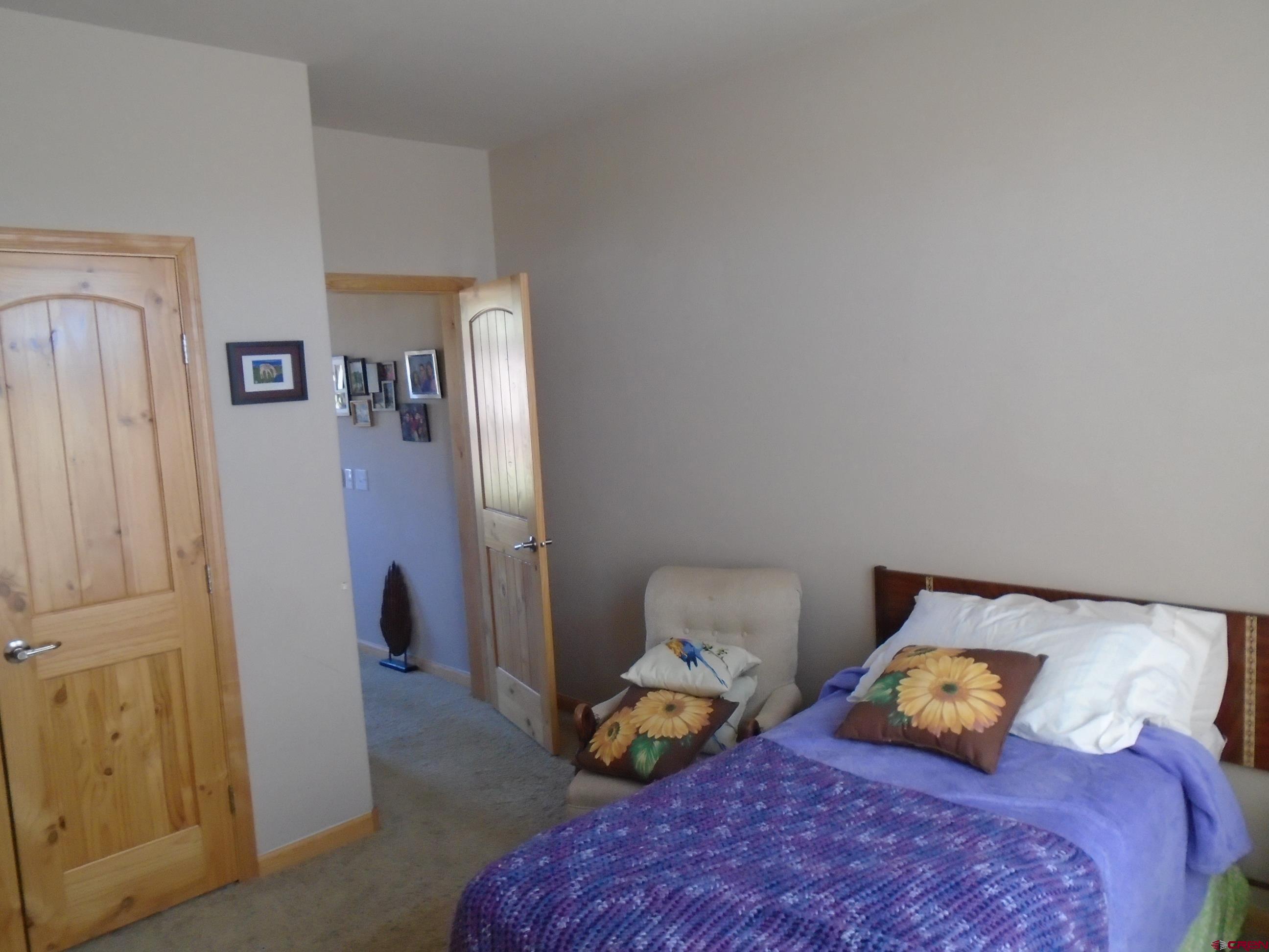 23041 T Road Cedaredge, CO 81413 - Photo 23 of 28 a bedroom with two beds and a lamp