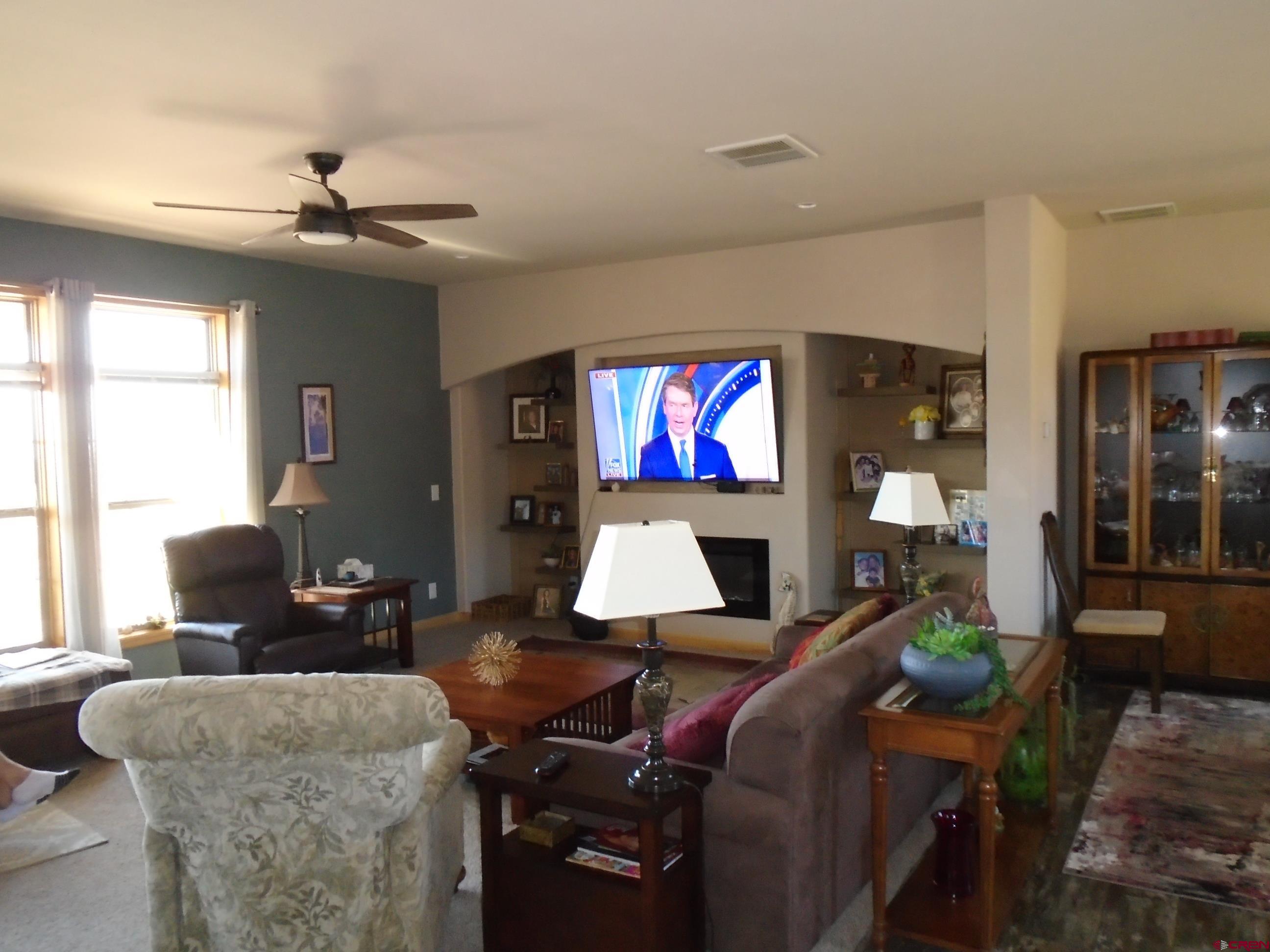 23041 T Road Cedaredge, CO 81413 - Photo 24 of 28 a living room with furniture and a flat screen tv