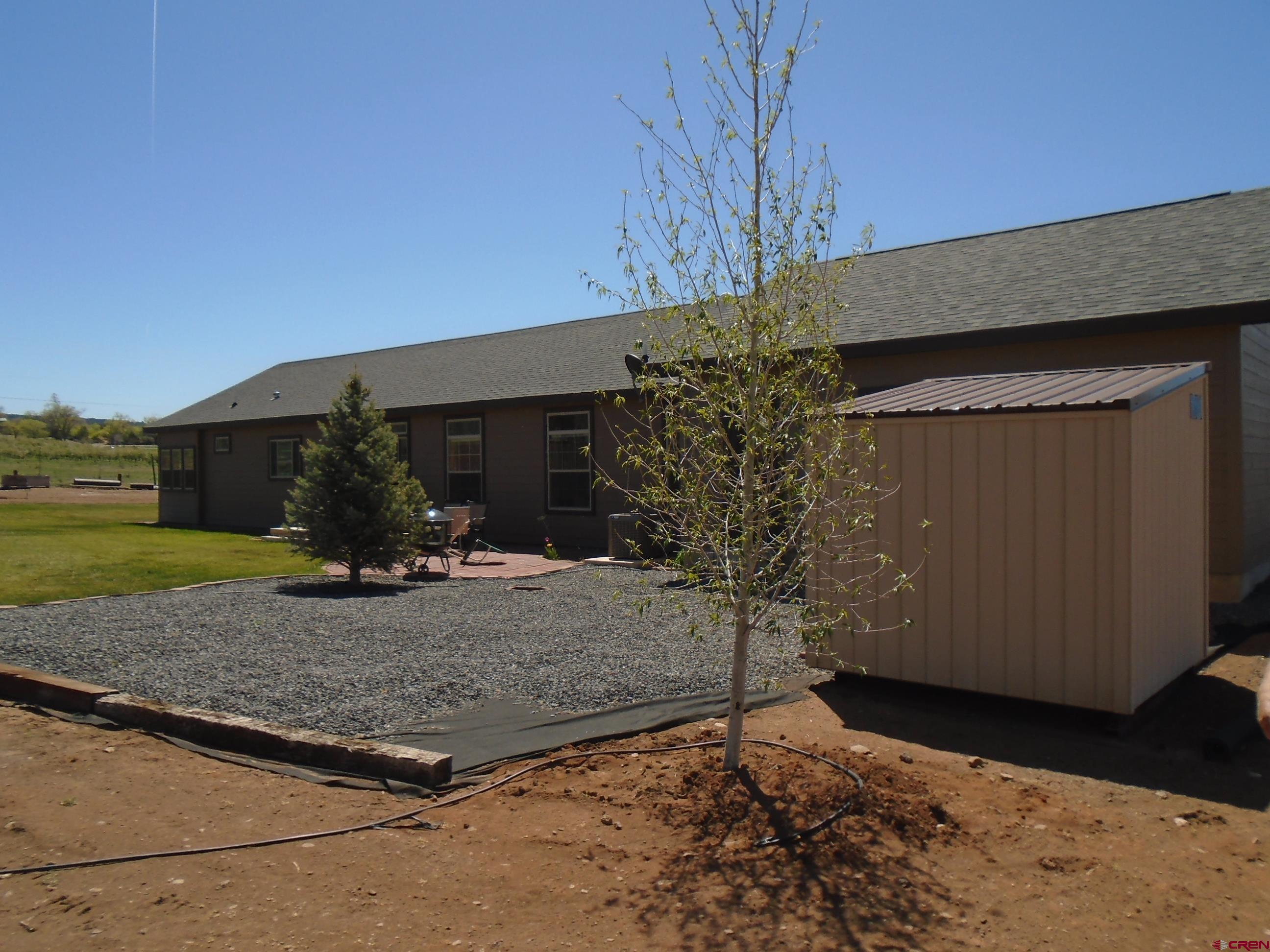 23041 T Road Cedaredge, CO 81413 - Photo 7 of 28 a view of a house with a tree