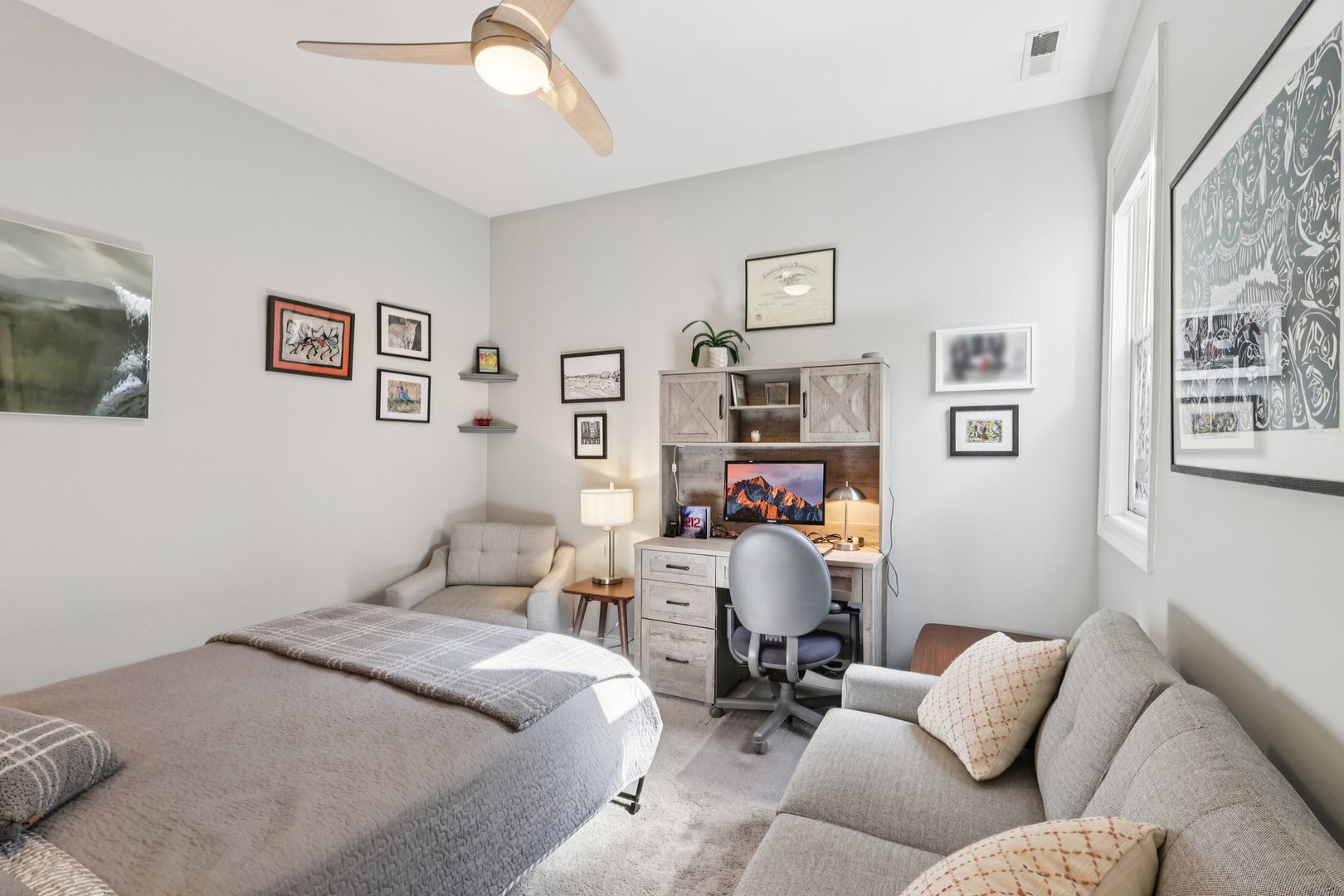 1473 West Irving Park Road, Unit 4E Chicago, IL 60613 - Photo 15 of 44 a bedroom with furniture and a couch