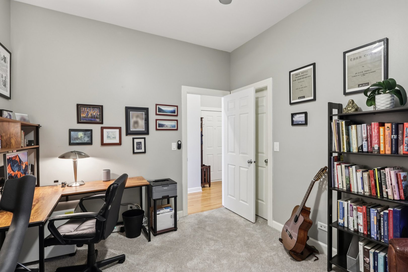 1473 West Irving Park Road, Unit 4E Chicago, IL 60613 - Photo 19 of 44 a view of a workspace with bookshelf and a workspace