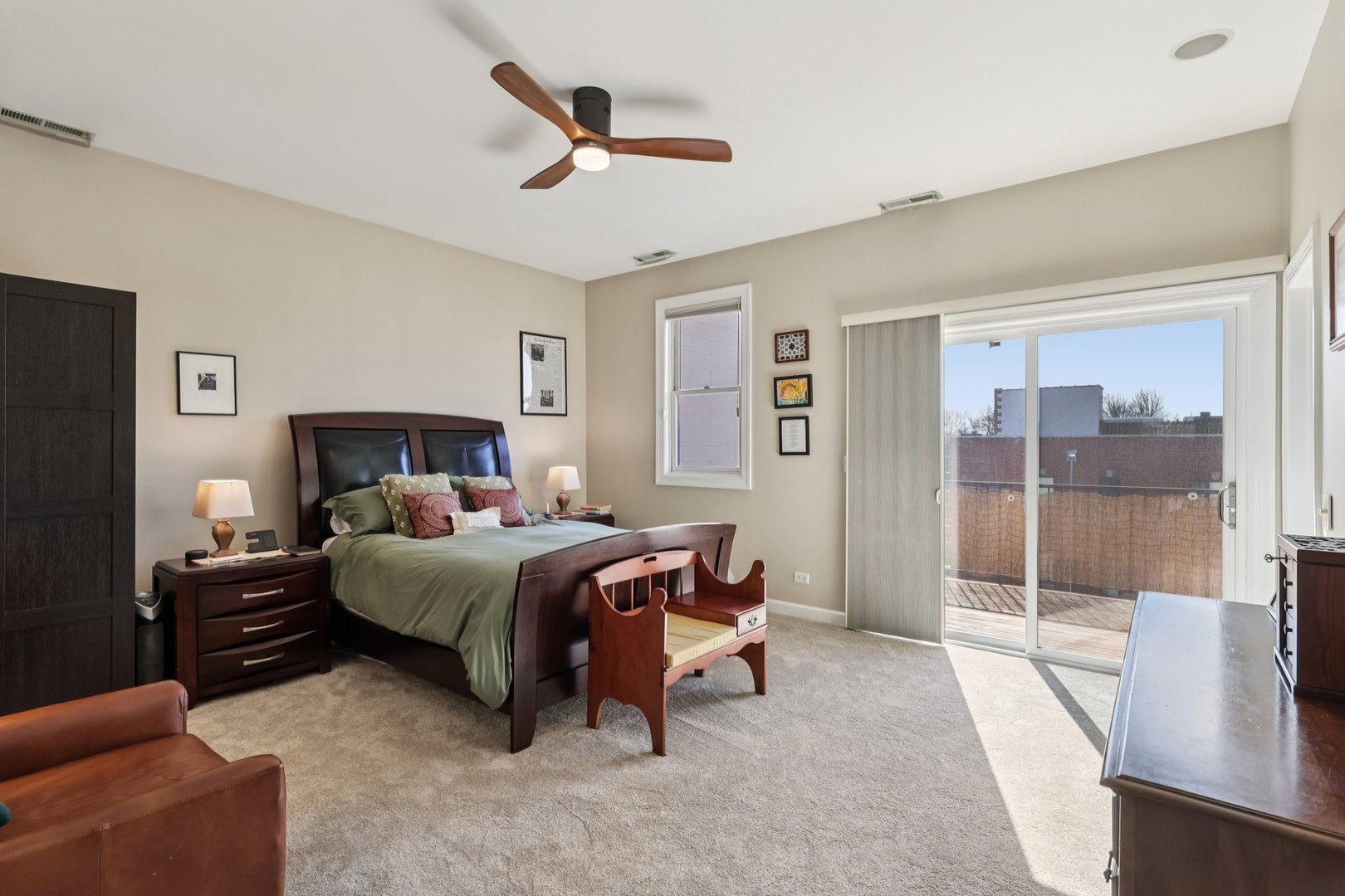1473 West Irving Park Road, Unit 4E Chicago, IL 60613 - Photo 20 of 44 a bedroom with a bed and a large window