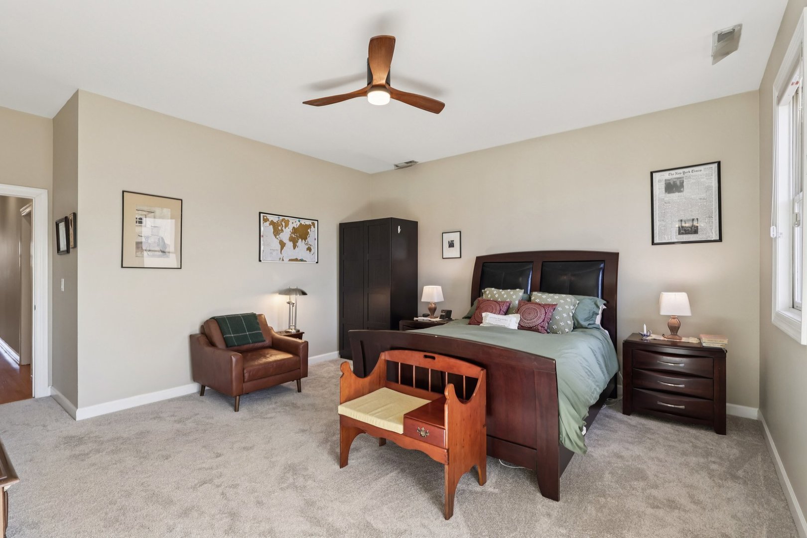 1473 West Irving Park Road, Unit 4E Chicago, IL 60613 - Photo 21 of 44 a bedroom with a bed and a chair