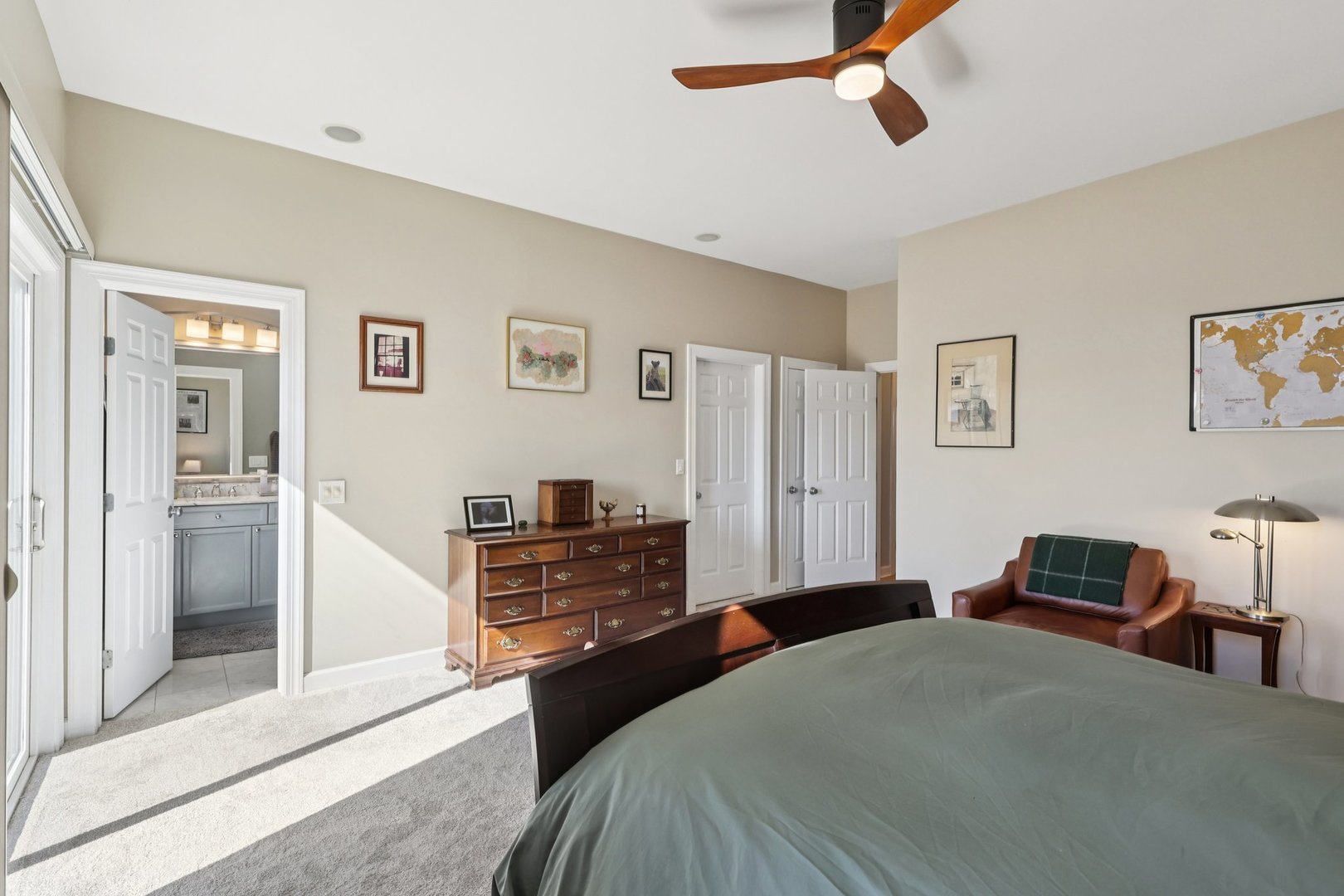 1473 West Irving Park Road, Unit 4E Chicago, IL 60613 - Photo 22 of 44 a bedroom with a bed and a chandelier