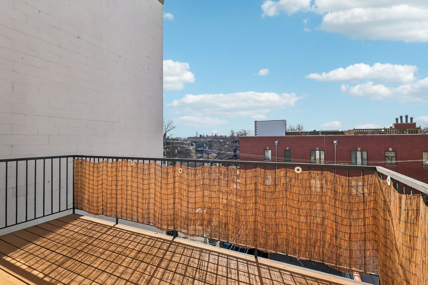 1473 West Irving Park Road, Unit 4E Chicago, IL 60613 - Photo 25 of 44 a view of balcony with wooden floor