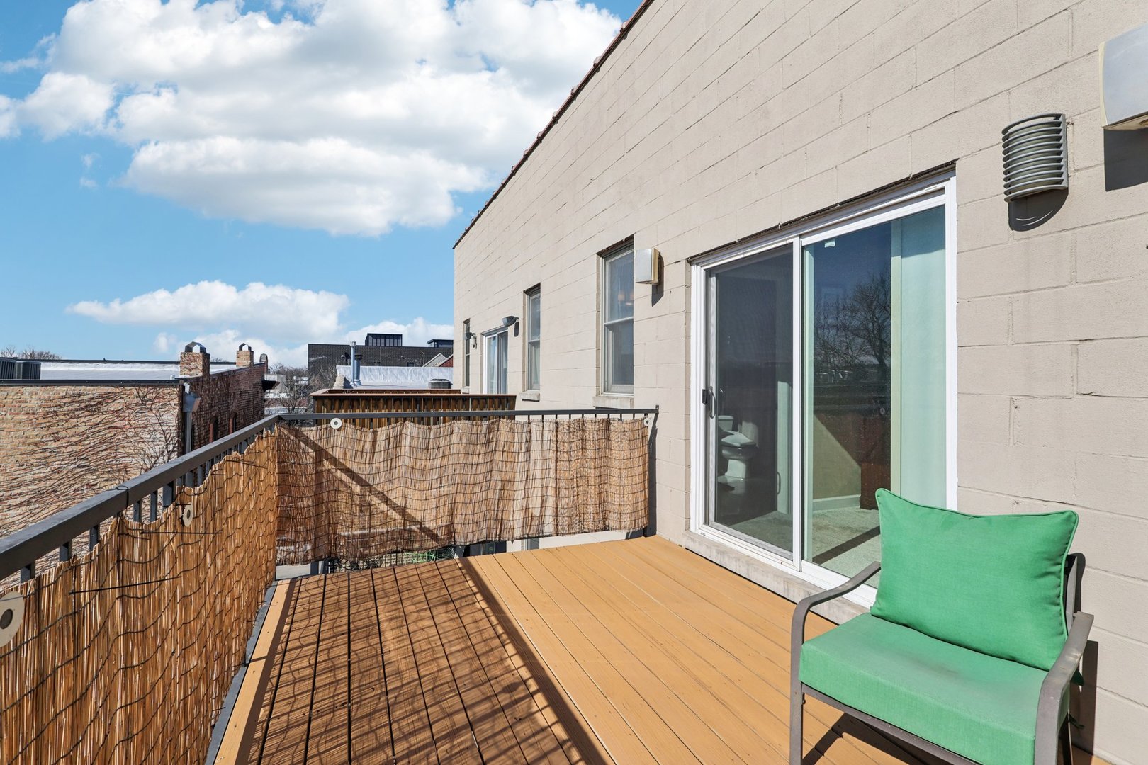 1473 West Irving Park Road, Unit 4E Chicago, IL 60613 - Photo 26 of 44 a view of balcony with wooden floor and seating space