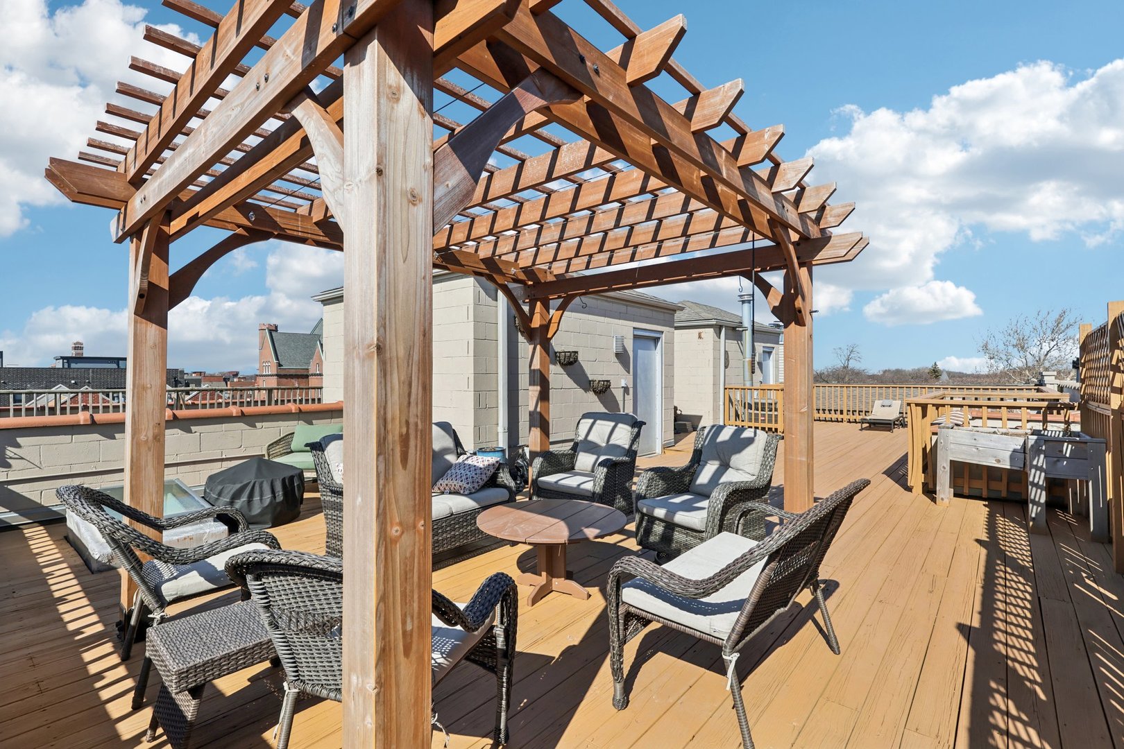 1473 West Irving Park Road, Unit 4E Chicago, IL 60613 - Photo 31 of 44 a view of a patio with a dining table and chairs with wooden floor