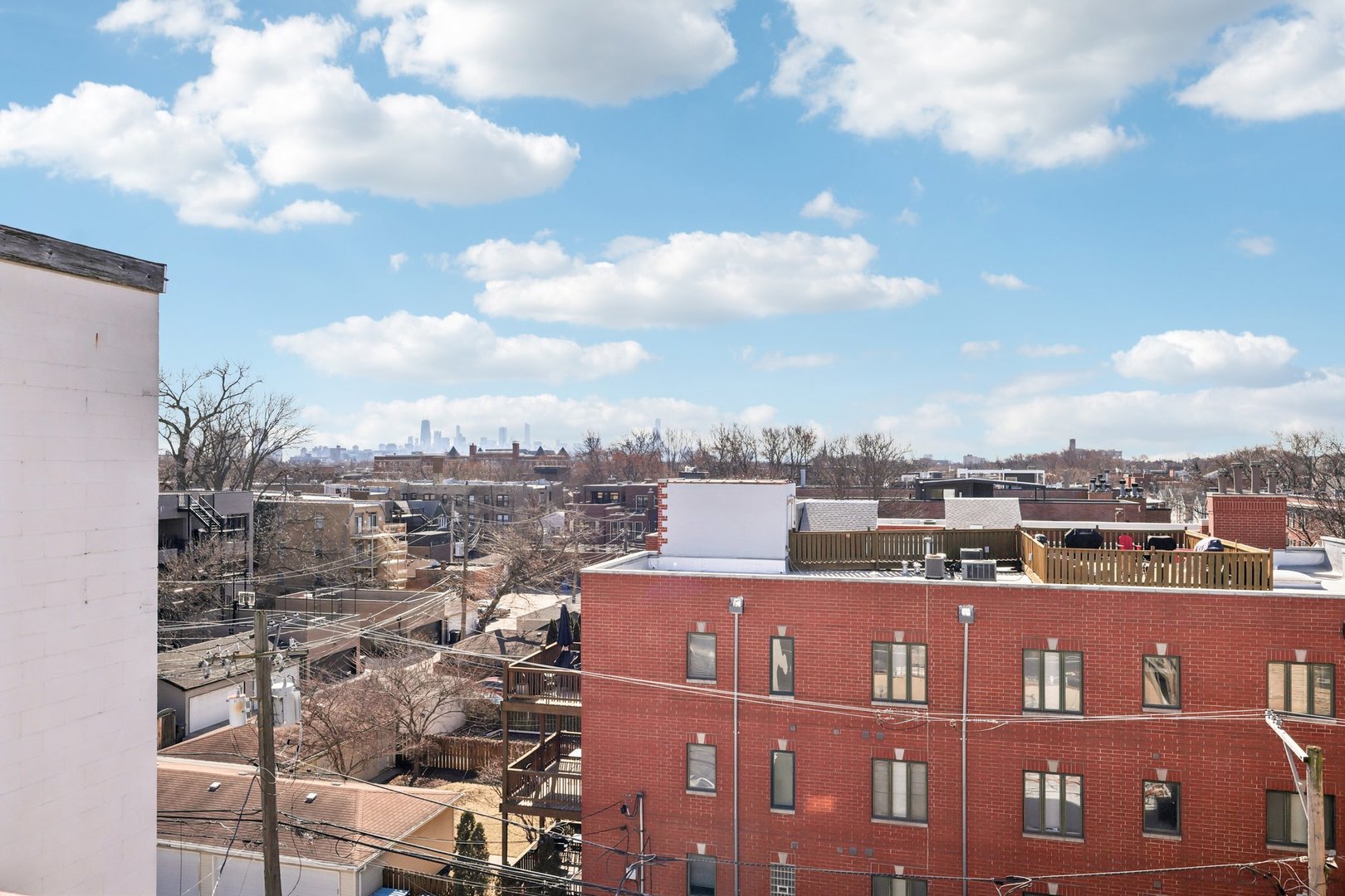 1473 West Irving Park Road, Unit 4E Chicago, IL 60613 - Photo 32 of 44 a view of a city with tall buildings