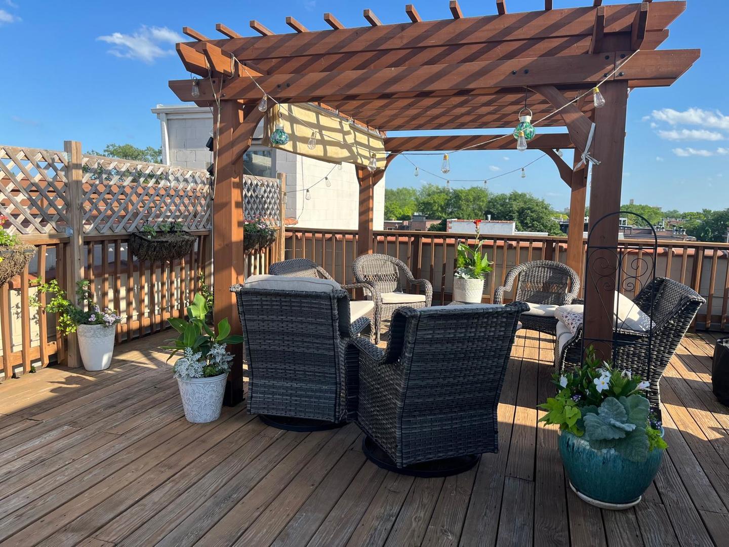 1473 West Irving Park Road, Unit 4E Chicago, IL 60613 - Photo 34 of 44 a view of a balcony with wooden floor
