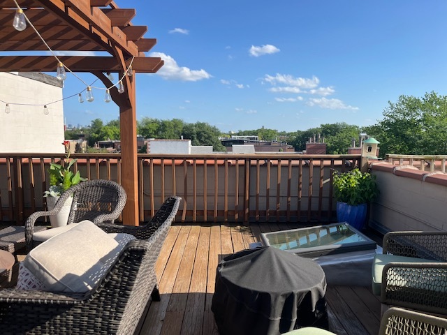 1473 West Irving Park Road, Unit 4E Chicago, IL 60613 - Photo 36 of 44 a view of a balcony with furniture