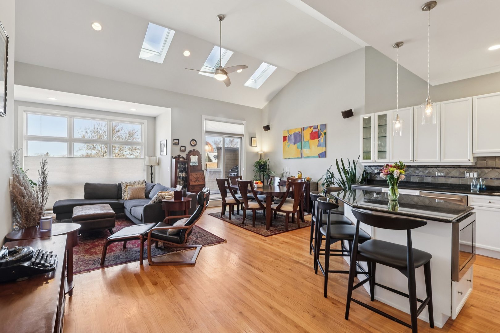 1473 West Irving Park Road, Unit 4E Chicago, IL 60613 - Photo 6 of 44 a living room with furniture and wooden floor