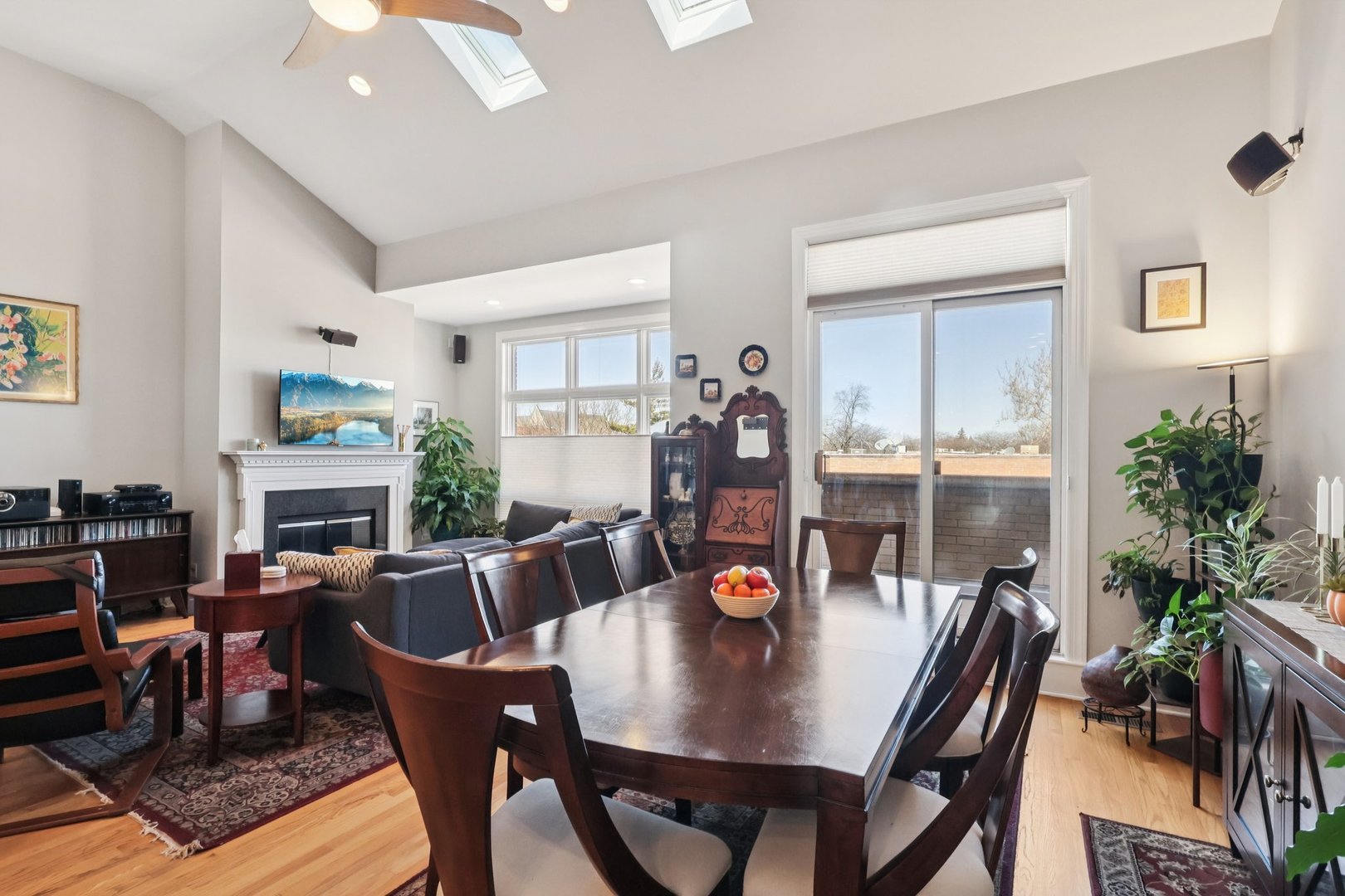1473 West Irving Park Road, Unit 4E Chicago, IL 60613 - Photo 9 of 44 a view of a dining room with furniture and wooden floor
