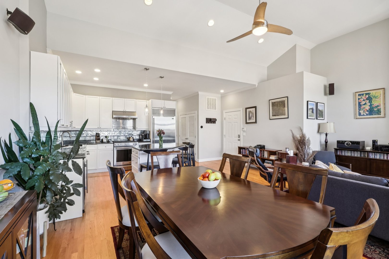 1473 West Irving Park Road, Unit 4E Chicago, IL 60613 - Photo 10 of 44 a living room with dining room and wooden floor