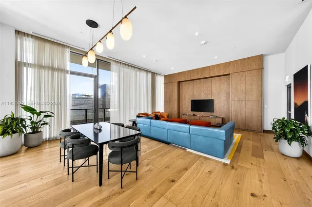 a bed room with a bed and a television