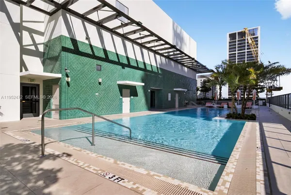 a kitchen with stainless steel appliances kitchen island furniture and a window