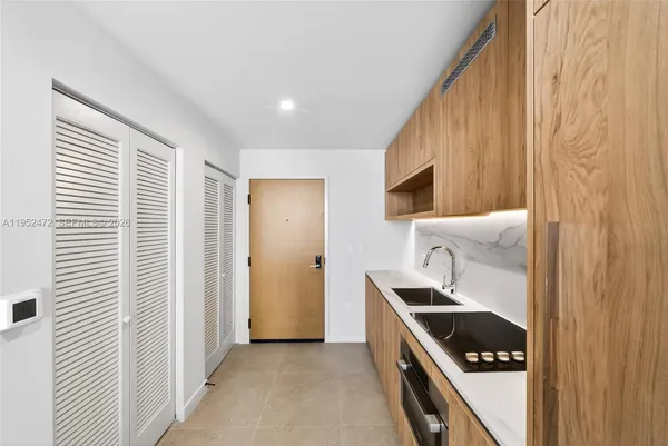 a kitchen with a stove and a microwave