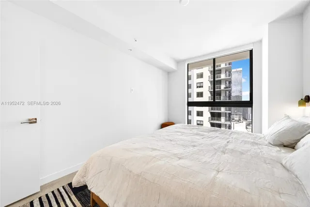 a view of a balcony with a barbeque