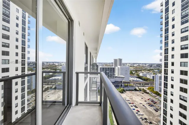 a view of balcony with wooden floor